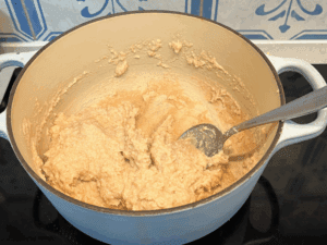 Mixing the homemade play-dough ingredients in a pot